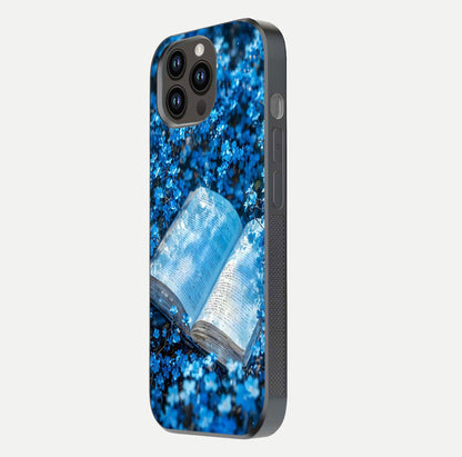 Blue Bloom Tales Glass Case for iPhone 14 Pro Max side-angle image showing blue floral pattern and glossy finish