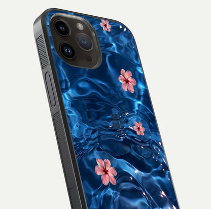 Blooming Water Drift Glass Case for iPhone 14 Pro Max close-up angle showing petal details, soft aqua tones, and smooth gloss reflection