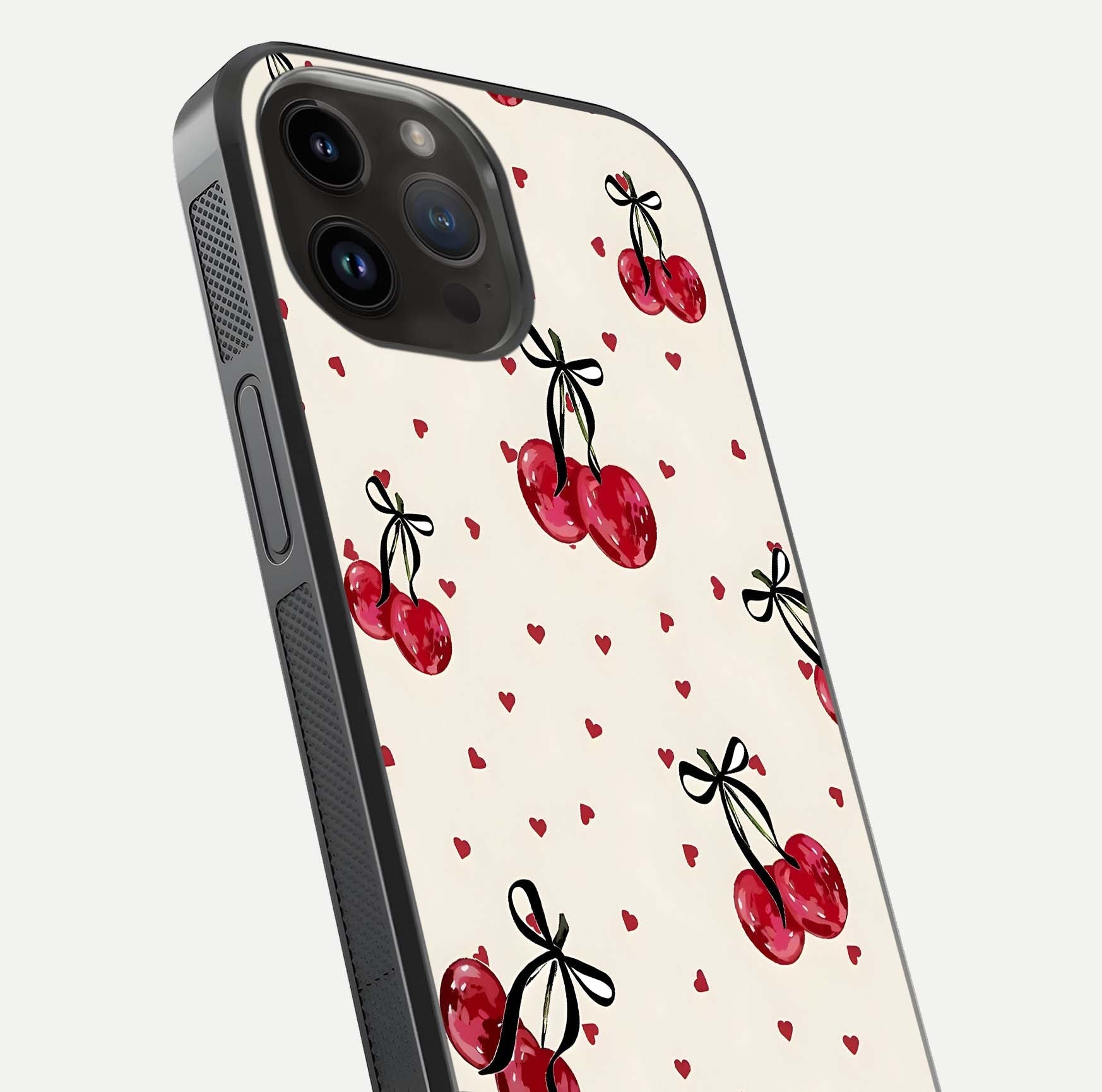 Cherry Heart Bow Glass Case for iPhone 14 Pro Max close-up highlighting small bows, cherry red tones, and gloss shine