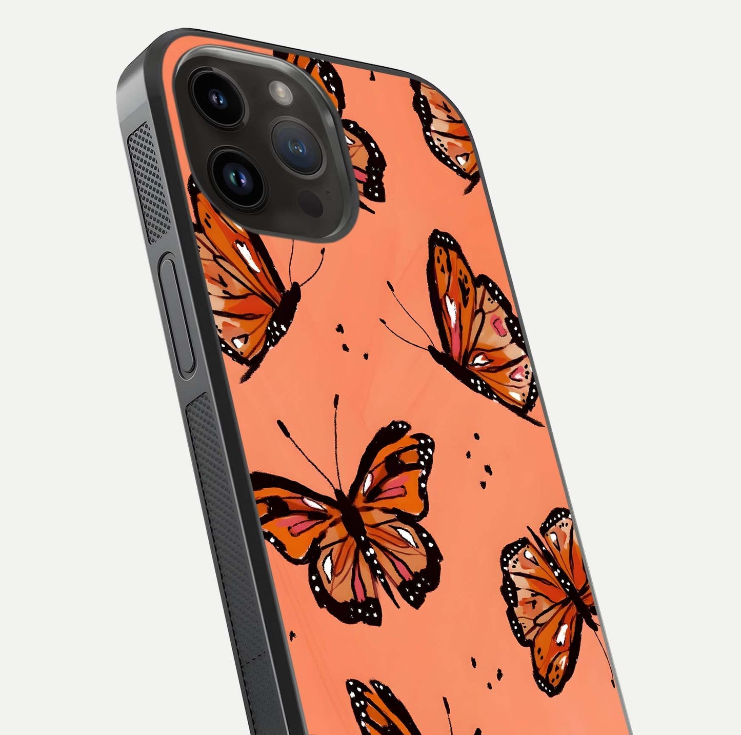Coral Wing Butterfly Glass Case for iPhone 14 Pro Max close-up highlighting wing pattern, coral tones, and reflection shine