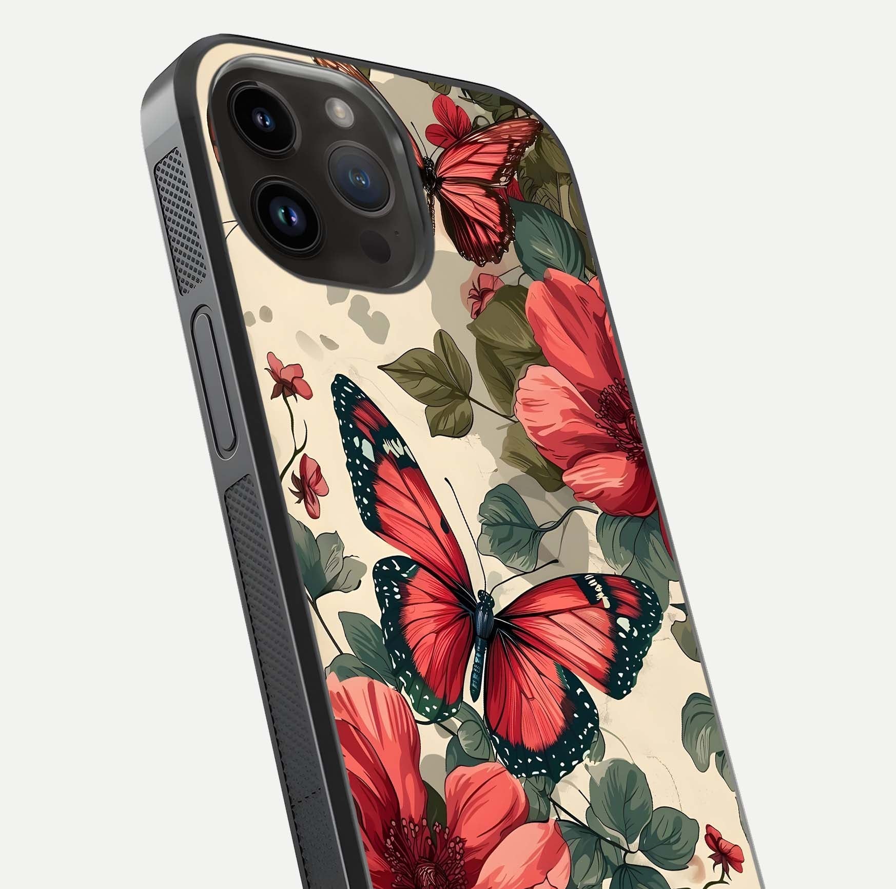 Crimson Butterfly Garden Glass Case for iPhone 14 Pro Max close-up showing wing detail and reflection shine
