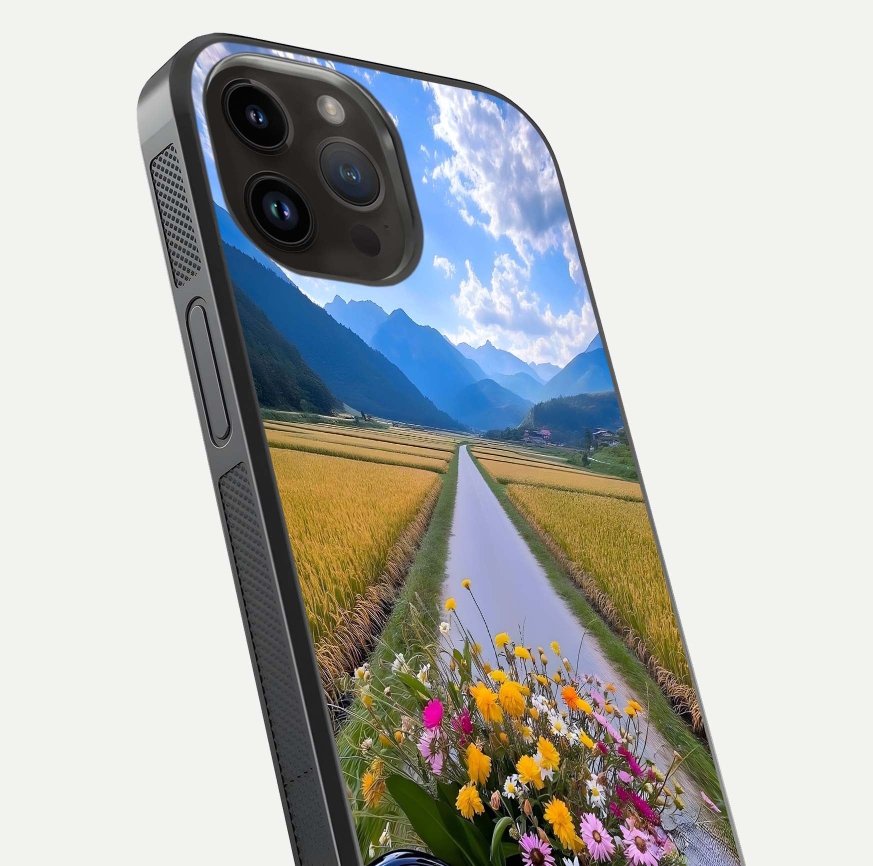 Golden Field Journey Glass Case for iPhone 14 Pro Max close-up angled shot showing sunlight tones and reflection clarity