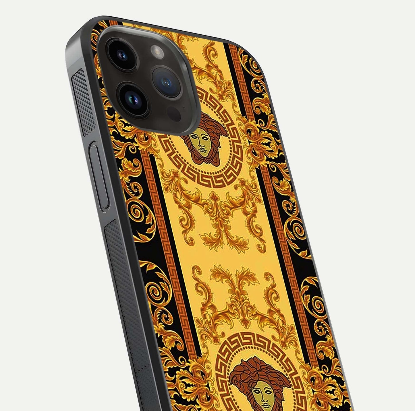 Golden Royal Heritage Glass Case for iPhone 14 Pro Max close-up angled shot showing intricate design and metallic reflection