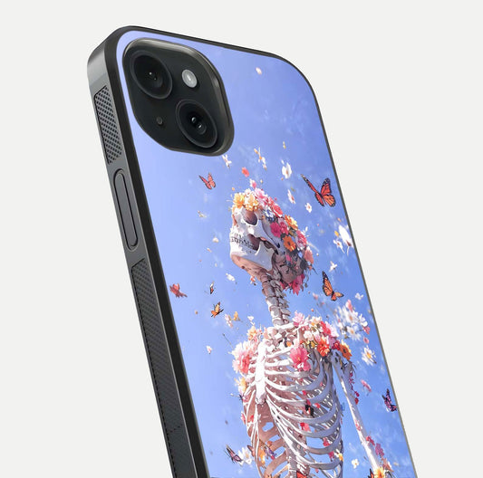 Bloom Beyond Bones Glass Case for iPhone 15 close-up highlighting unique bone-floral fusion art and reflection