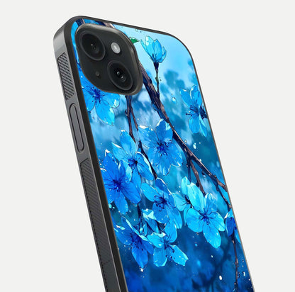 Blue Blossoms Branch Glass Case for iPhone 15 close-up angle highlighting petal details and reflection gloss