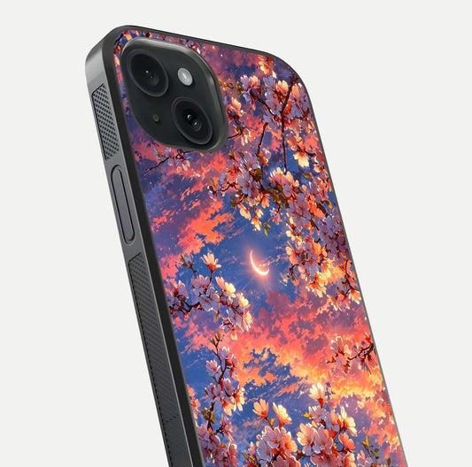 Celestial Sakura Sunset Glass Case for iPhone 15 close-up image highlighting blossom petals and gloss shine