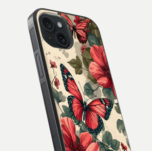 Crimson Butterfly Garden Glass Case for iPhone 15 close-up showing wing detail and reflection shine