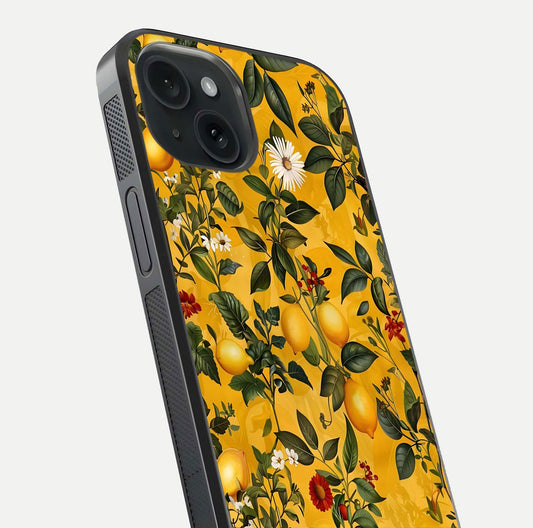 Golden Lemon Field Glass Case for iPhone 15 close-up angled shot showing citrus texture and reflection brilliance
