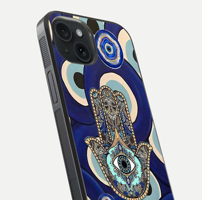 Hamsa Divine Guard Glass Case for iPhone 15 close-up angled shot showing detailed palm motif and reflection glow