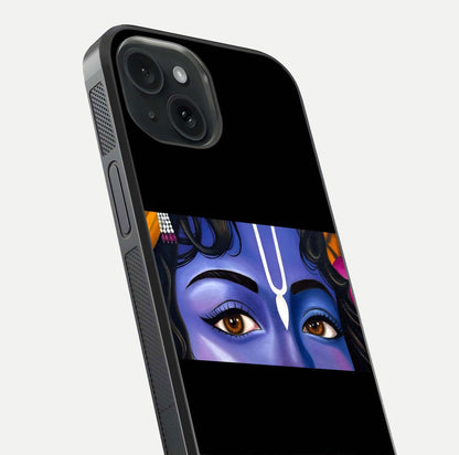 Krishna Eye Glass Case for iPhone 15 close-up angled shot showing intricate artwork and reflection shine