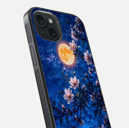 Moonlit Blossoms Night Glass Case for iPhone 15 close-up angled shot showing petal glow and reflection detail