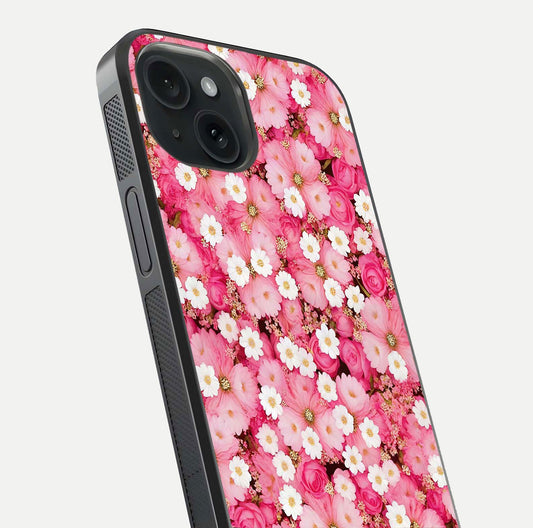 Pink Daisy Bliss Glass Case for iPhone 15 close-up angled shot highlighting daisy detail and reflection glow