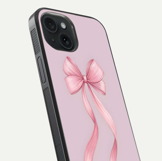 Soft Blush Bow iPhone 15  glass phone case angled back view highlighting bow artwork and side grip texture