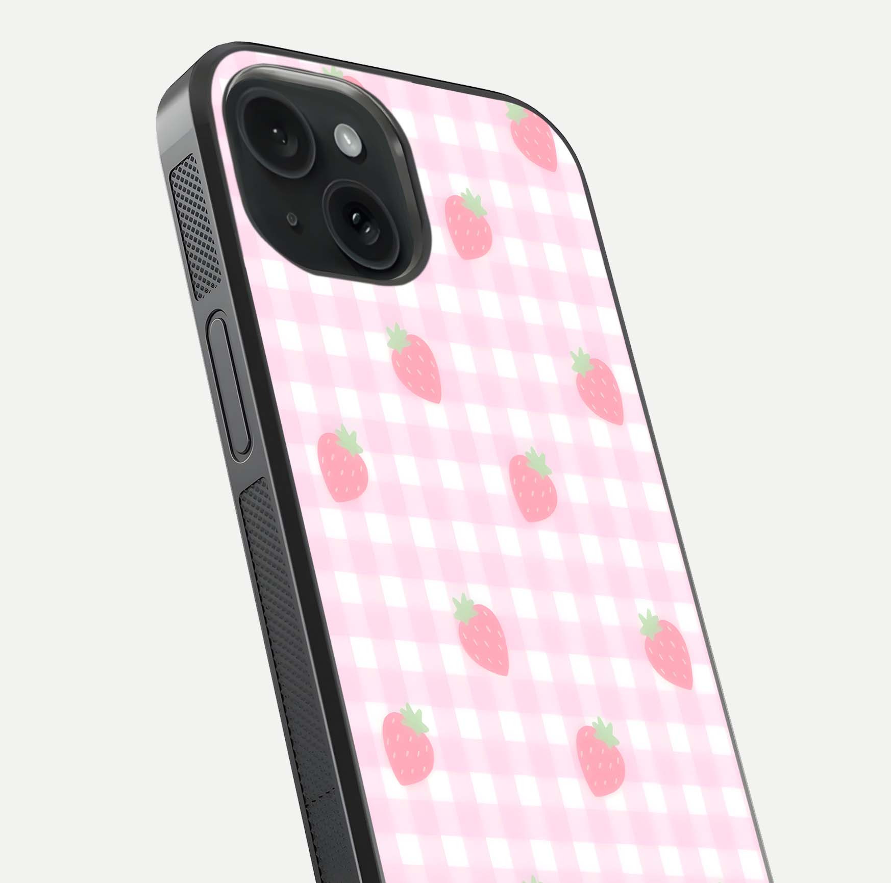 Strawberry Picnic Love iPhone 15  glass phone case angled back view highlighting strawberry illustrations and textured grip