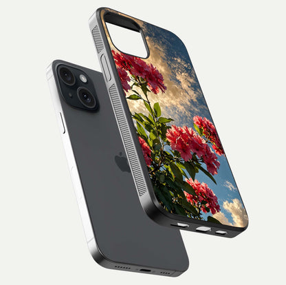 Red Bloom Skies Glass Case for iPhone 15 floating dual-view mockup showing glass gloss and floral pattern