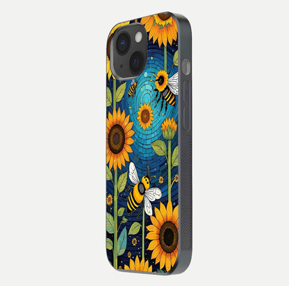 Bees & Sunflowers Glass Case for iPhone 15 side-angle image showing bee pattern alignment and shiny protective surface