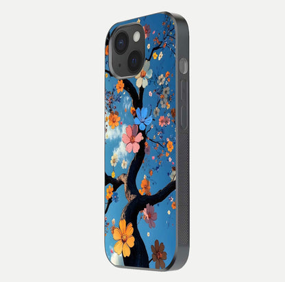 Blossom Dream Sky Glass Case for iPhone 15 side-angle photo showing flower details, edge curve, and reflection shine