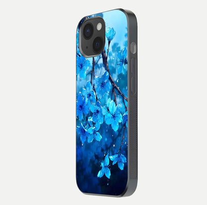 Blue Blossoms Branch Glass Case for iPhone 15 side-angle image showing blossom pattern flow and glossy texture