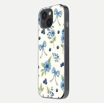 Blue Flower & Bow Glass Case for iPhone 15 side-angle image showing bow-floral mix and HD finish shine
