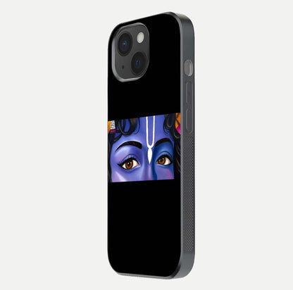 Krishna Eye Glass Case for iPhone 15 side-angle image showing reflection clarity and Krishna symbol design