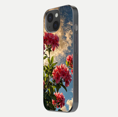 Red Bloom Skies Glass Case for iPhone 15 side-angle image showing reflection, print clarity, and tone blend