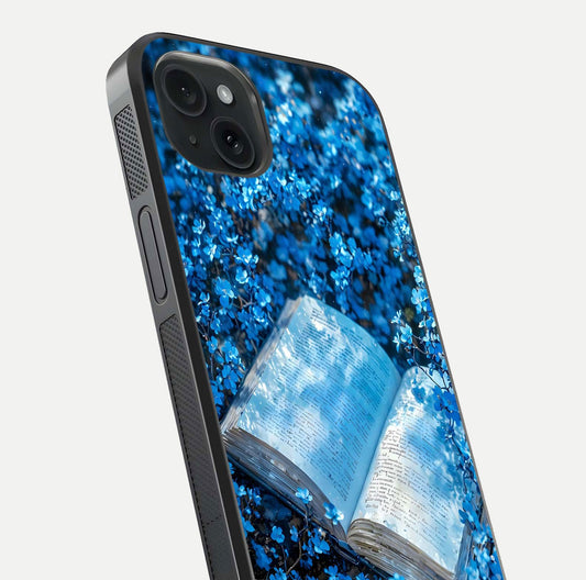 Blue Bloom Tales Glass Case for iPhone 15 Plus close-up angle showing petal texture and blue tone reflection