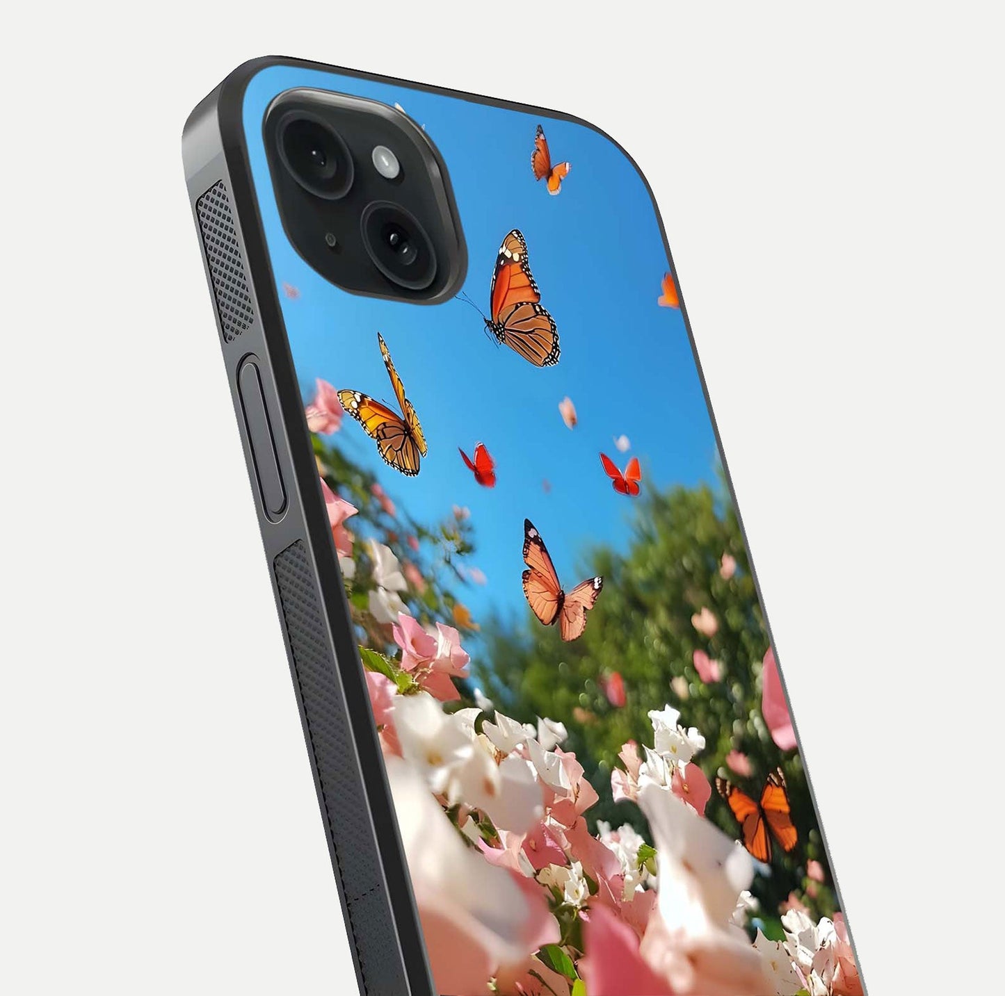 Butterflies in Bloom Sky Glass Case for iPhone 15 Plus close-up shot showing wings, petal reflections, and soft hues
