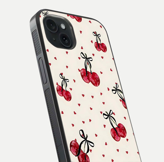 Cherry Heart Bow Glass Case for iPhone 15 Plus close-up highlighting small bows, cherry red tones, and gloss shine