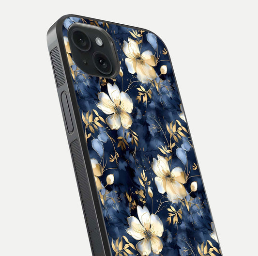 Golden Midnight Bloom Glass Case for iPhone 15 Plus close-up angled shot showing floral detail and reflection shine