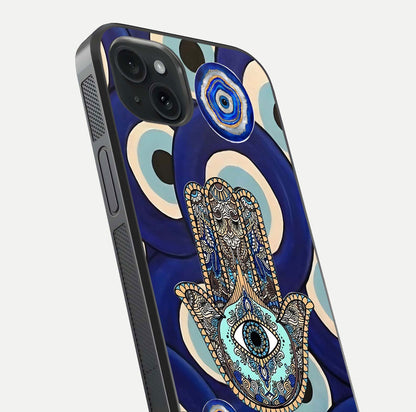 Hamsa Divine Guard Glass Case for iPhone 15 Plus close-up angled shot showing detailed palm motif and reflection glow