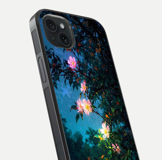 Midnight Bloom Glow Glass Case for iPhone 15 Plus close-up angled shot showing petal highlights and glow reflection
