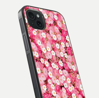 Pink Daisy Bliss Glass Case for iPhone 15 Plus close-up angled shot highlighting daisy detail and reflection glow