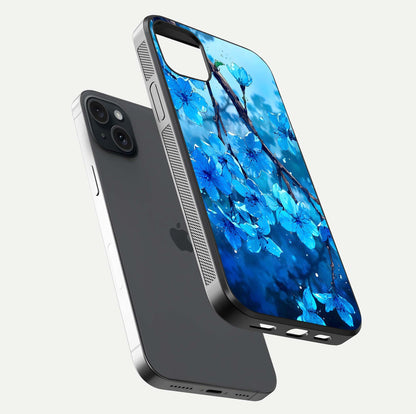 Blue Blossoms Branch Glass Case for iPhone 15 Plus floating mockup showing shine, curved edges, and branch detailing
