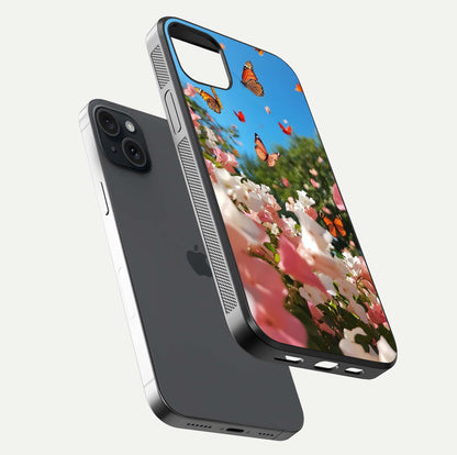 Butterflies in Bloom Sky Glass Case for iPhone 15 Plus floating mockup capturing butterfly motion and edge design