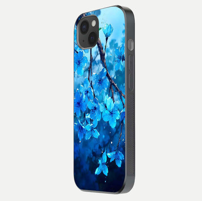 Blue Blossoms Branch Glass Case for iPhone 15 Plus side-angle image showing blossom pattern flow and glossy texture