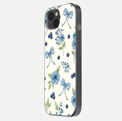 Blue Flower & Bow Glass Case for iPhone 15 Plus side-angle image showing bow-floral mix and HD finish shine