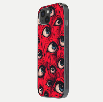 Crimson Watch Eyes Glass Case for iPhone 15 Plus side-angle photo showing reflection texture and shine