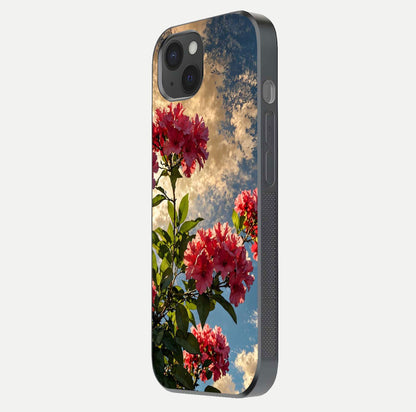 Red Bloom Skies Glass Case for iPhone 15 Plus side-angle image showing reflection, print clarity, and tone blend
