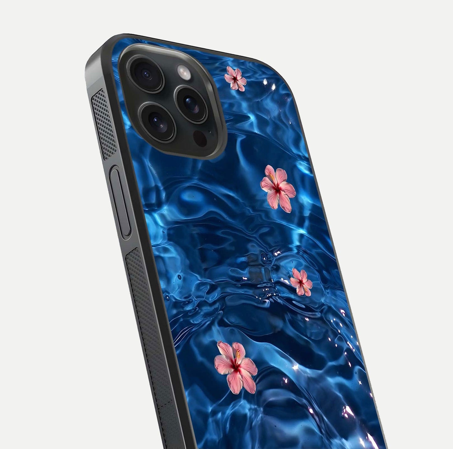 Blooming Water Drift Glass Case for iPhone 15 Pro close-up angle showing petal details, soft aqua tones, and smooth gloss reflection