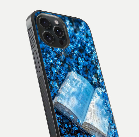 Blue Bloom Tales Glass Case for iPhone 15 Pro close-up angle showing petal texture and blue tone reflection