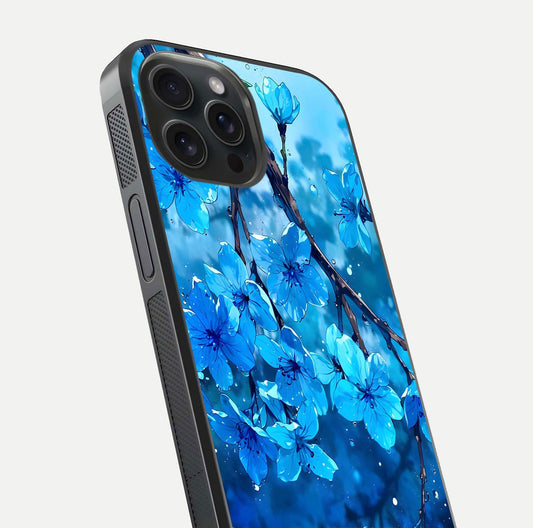 Blue Blossoms Branch Glass Case for iPhone 15 Pro close-up angle highlighting petal details and reflection gloss