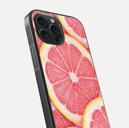 Glitter Grapefruit Glass Case for iPhone 15 Pro close-up angled shot showing fruit texture and glitter reflection