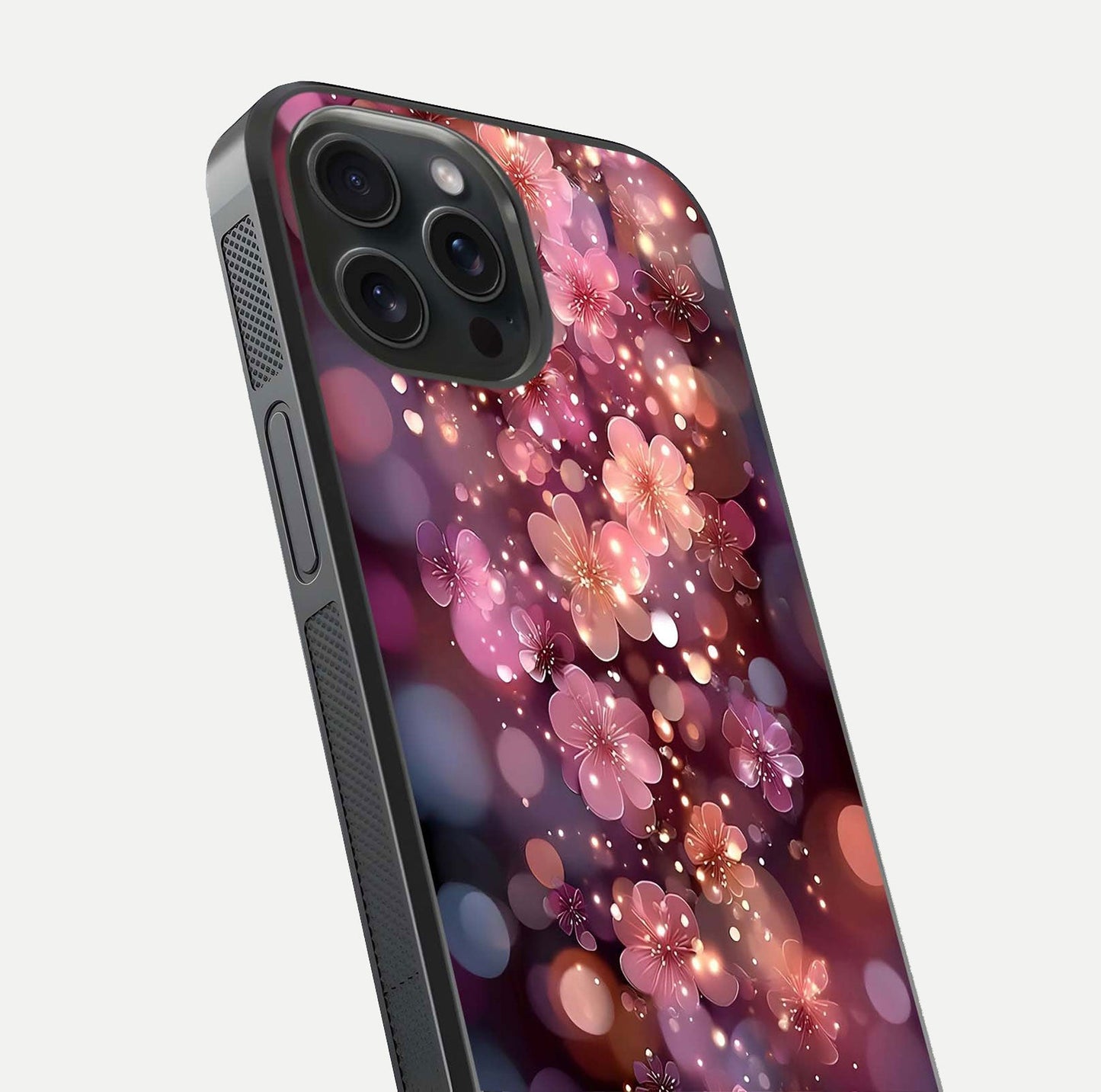 Glowing Petal Bliss Glass Case for iPhone 15 Pro close-up angled shot showing petal glow, color depth, and reflection shine