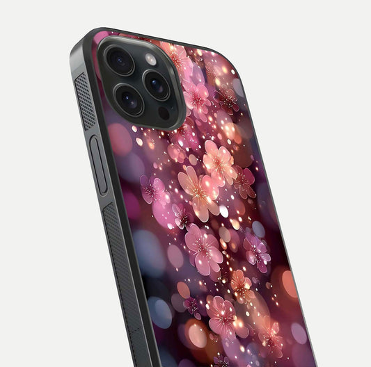 Glowing Petal Bliss Glass Case for iPhone 15 Pro close-up angled shot showing petal glow, color depth, and reflection shine