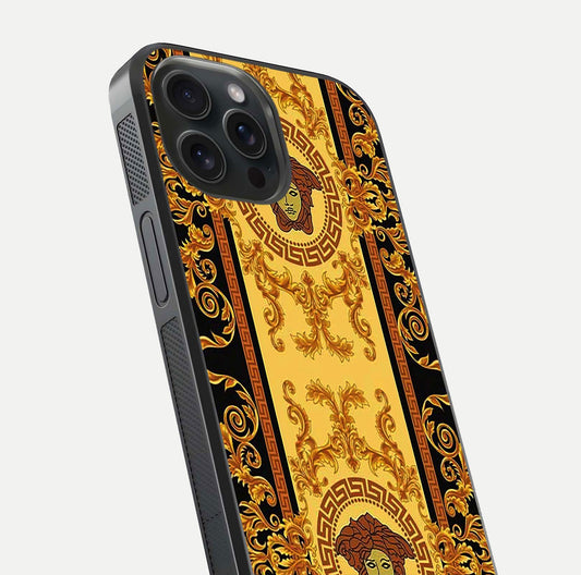 Golden Royal Heritage Glass Case for iPhone 15 Pro close-up angled shot showing intricate design and metallic reflection