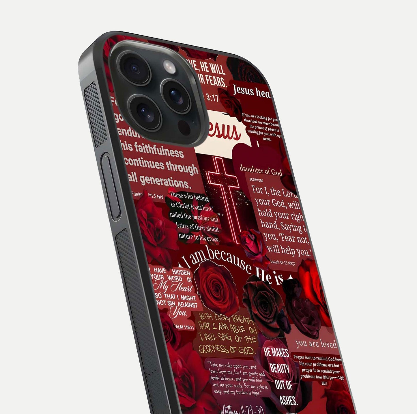 Jesus Love Heals Glass Case for iPhone 15 Pro close-up angled shot showing healing text, cross detailing, and reflection