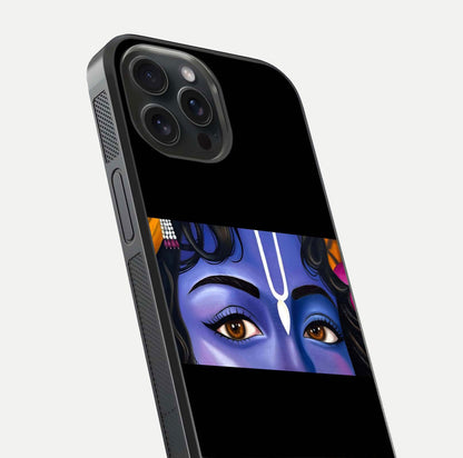Krishna Eye Glass Case for iPhone 15 Pro close-up angled shot showing intricate artwork and reflection shine