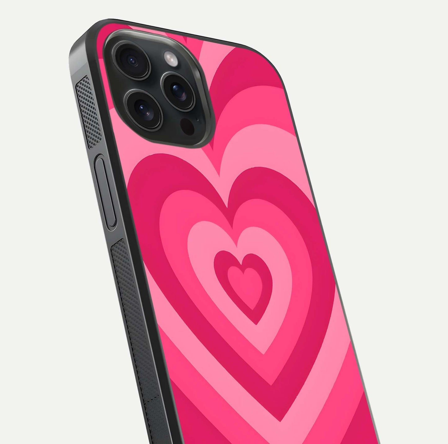 Layered Love Hearts iPhone 15 Pro glass phone case angled back view highlighting heart artwork and textured grip edges