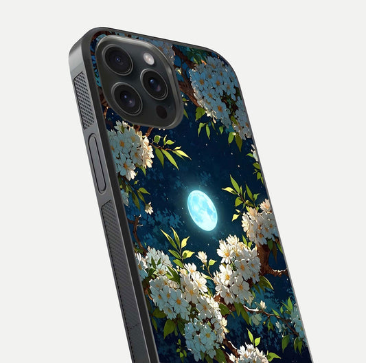 Moonlit Blossom Dream Glass Case for iPhone 15 Pro close-up angled shot showing glowing petals and reflection