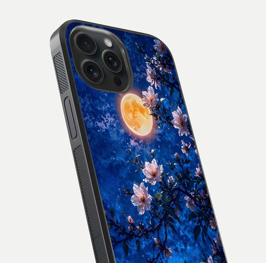 Moonlit Blossoms Night Glass Case for iPhone 15 Pro close-up angled shot showing petal glow and reflection detail